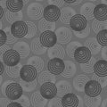Concentric circles with dotted outline in two colors. Seamless geometric pattern on dark gray background. Vector colorless image