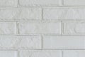 Light gray brick background. Old painted bricks texture. Horizontal photo. Closeup Royalty Free Stock Photo