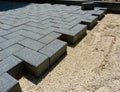 Sidewalk construction. grey color interlocking paving stones laid down Royalty Free Stock Photo