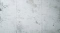 A light gray concrete wall with a minimalist texture, featuring small blemishes and cracks. The Royalty Free Stock Photo