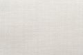 Light gray fabric background. Luxurious piece of white material for tailoring