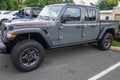 A light gray Jeep Gladiator Rubicon is a very popular vehicle on a dealership lot