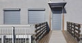 Metal blinds on the doors and windows of the facade of the house Royalty Free Stock Photo