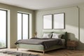 Light green bedroom interior with bed, linens and window, mockup posters Royalty Free Stock Photo