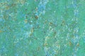 Light green cracked paint on a metal surface with rust elements. Average plan Royalty Free Stock Photo