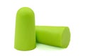 Light green ear plugs isolated on a white background.Close-up.Soft foam earplug Royalty Free Stock Photo
