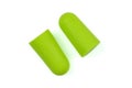 Light green ear plugs isolated on a white background.Close-up.Soft foam earplug Royalty Free Stock Photo