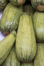 Light green fresh zucchini stacked in a heap shot from above, natural look on a market in Arequipa, Peru