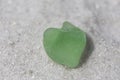 Light Green Heart Shaped Sea Glass on Sand