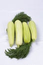 Light green marrow squash and dark green dill isolated at white background Royalty Free Stock Photo