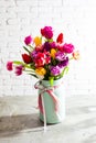 Metal vase with beautiful tulips in bloom Royalty Free Stock Photo