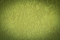 Light green paint rough plaster wall solid background structure dark vignette abstract design structure Royalty Free Stock Photo