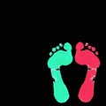 Light green and red footprint on black background .Colored foot Prints on Watercolor design. Royalty Free Stock Photo