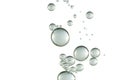 Shiny transparent bubbles over a white surface Royalty Free Stock Photo