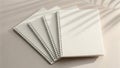 Light green spiral bound notebooks stacked with soft shadow play overhead view Royalty Free Stock Photo