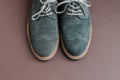 light green suede derby shoes on brown background Royalty Free Stock Photo