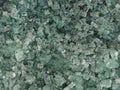 Light green texture of a pile of broken glass