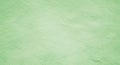 Light green textured background resembling paper, featuring a subtle, uniform pattern. The surface Royalty Free Stock Photo