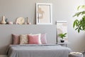 Light grey bedroom interior with king-size bed with many cushion Royalty Free Stock Photo