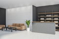 Light grey front desk with sofa in the corner Royalty Free Stock Photo