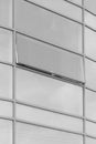 Light grey glass facade office building modern look architecture reflects sky cloudy open window Royalty Free Stock Photo