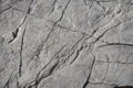 Light grey rock texture background with cracked surface