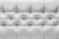 Light grey or white leather upholstery sofa with pattern button design furniture style decor texture background Royalty Free Stock Photo