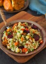 Light healthy dietary vegan dish: couscous with fresh and baked vegetables