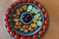 Light, healthy vegetarian appetizers on fun retro platter