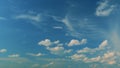 Light High Clouds Slide On Sky. Puffy Fluffy White Clouds Sky. Blue Sky With Clouds Moving In Opposite Direction And Sun Royalty Free Stock Photo