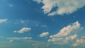 Light High Clouds Slide On Sky. Puffy Fluffy White Clouds Sky. Blue Sky With Clouds Moving In Opposite Direction And Sun Royalty Free Stock Photo