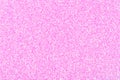 Light holographic glitter background, wallpaper in pink tone with little sparkles.