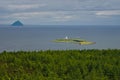 Light house on Pladda with the Granite Island of Ailsa Craig in Firth of Clyde, from Arran, Scotland