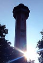 The light house silhouette with sun rays near manora fort.