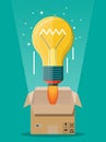 Light idea bulb ejected from cardboard box. Royalty Free Stock Photo