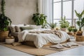 Light interior modern cozy bedroom with vintage carpet and indoor plants. Large window. Scandi boho style. Natural materials Royalty Free Stock Photo