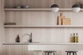 Light kitchen interior with table and seats, shelf with kitchenware Royalty Free Stock Photo