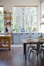 Light kitchen interior with wooden details Royalty Free Stock Photo