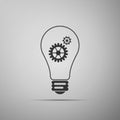 Light lamp sign icon isolated on grey background. Bulb with gears and cogs working together symbol. Idea concept Royalty Free Stock Photo