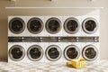 Light laundry interior with washing machines in row Royalty Free Stock Photo