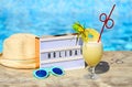 Light letterbox, hat, sunglasses and pinacolada cocktail Royalty Free Stock Photo