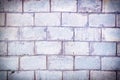 Light lilac wall made of large bricks. Blank background with brickwork texture.