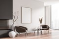 Light living room interior with armchairs, fireplace and window, mockup frame Royalty Free Stock Photo