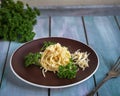 Light lunch with spaghetti and fresh green parsley, served on a devian tray Royalty Free Stock Photo