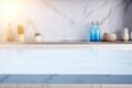 Light marble table with blurred modern blue colored kitchen set, photorealistic blurred bokeh background with copyspace Royalty Free Stock Photo