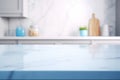 Light marble table with blurred modern blue colored kitchen set, photorealistic blurred bokeh background with copyspace Royalty Free Stock Photo