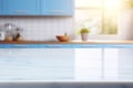 Light marble table with blurred modern blue colored kitchen set, photorealistic blurred bokeh background with copyspace Royalty Free Stock Photo