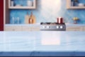 Light marble table with blurred modern blue colored kitchen set, photorealistic blurred bokeh background with copyspace Royalty Free Stock Photo