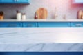 Light marble table with blurred modern blue colored kitchen set, photorealistic blurred bokeh background with copyspace Royalty Free Stock Photo