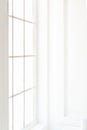 Light minimalist laconic interior with white walls, large window